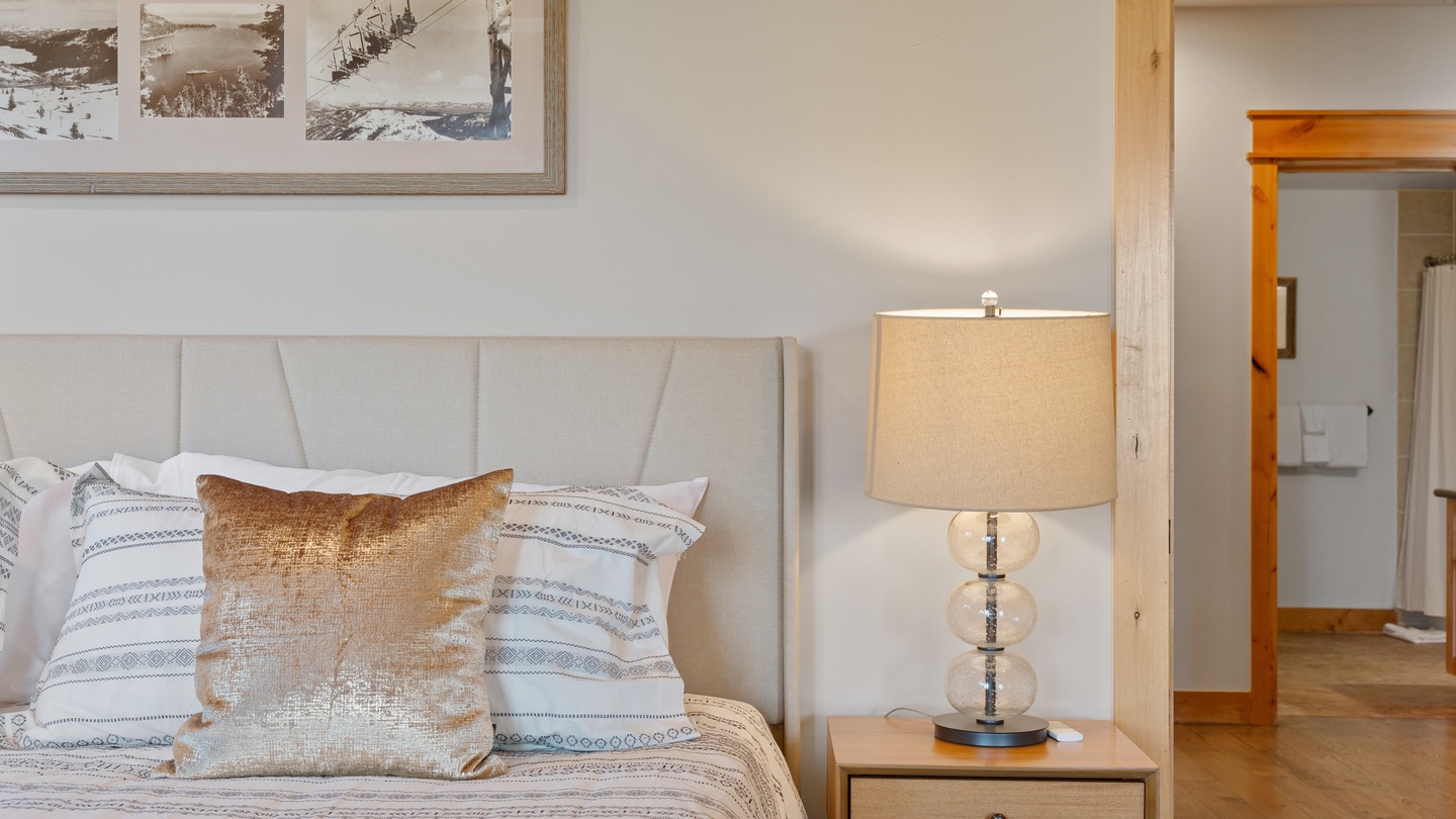 Sink into the plush upholstered headboard and crisp linens after a day of exploring. Soft lighting and thoughtful touches create your peaceful mountain retreat.