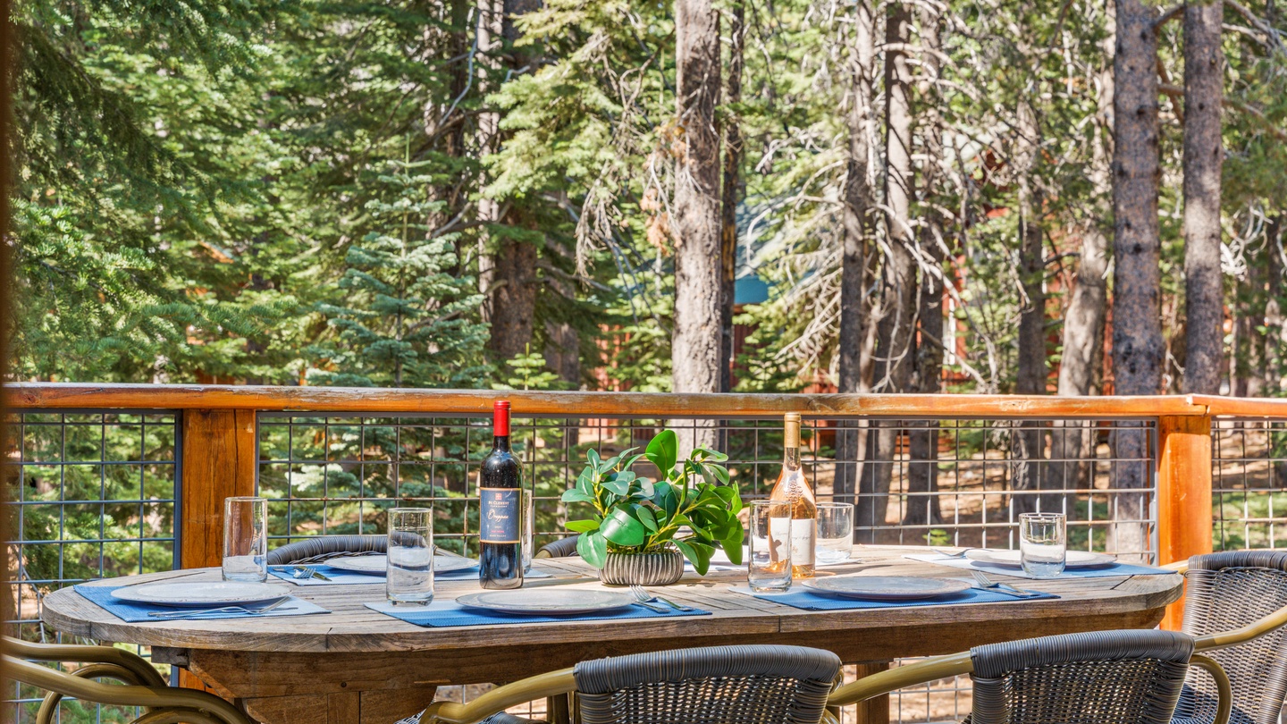Gather around this beautifully set table for meals surrounded by towering pines. Your private deck brings the tranquility of the forest right to your dining experience.