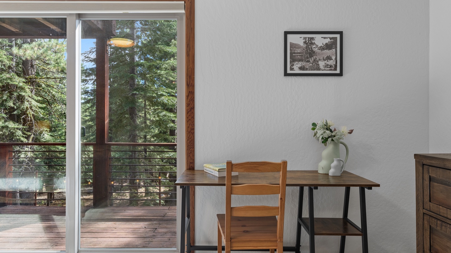 Step into your peaceful workspace with towering pines just beyond the glass, creating your own private forest retreat.