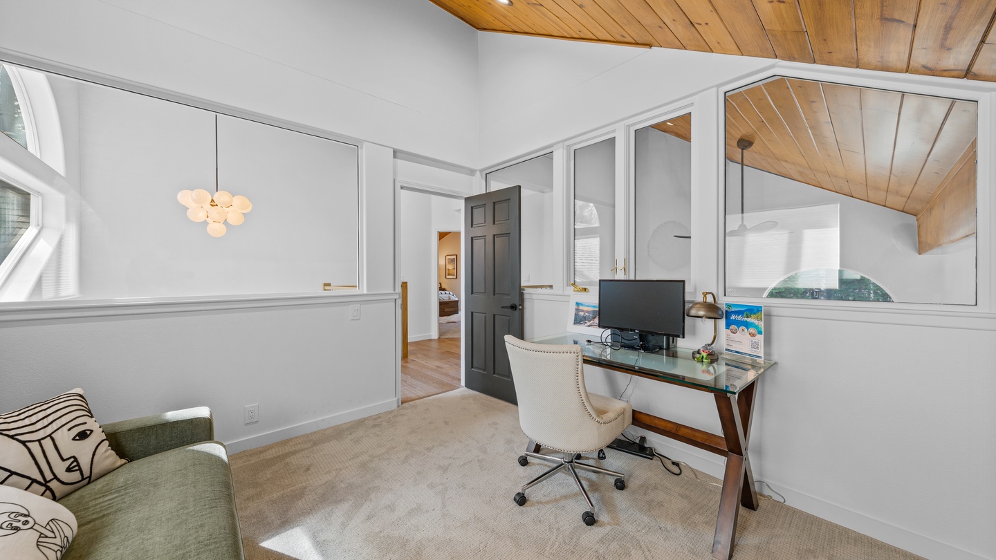 A quiet workspace with natural light and warm wood accents invites you to catch up on plans or simply unwind in this thoughtfully designed corner of your retreat.