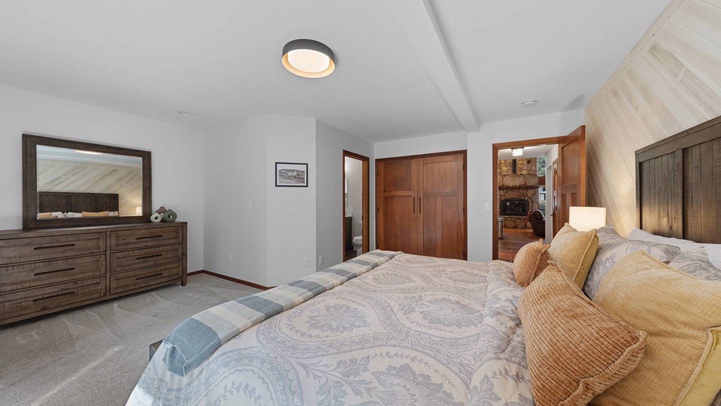 Your spacious retreat features vaulted ceilings and soft lighting, with elegant wood accents throughout. The warm tones and generous closet space create a soothing sanctuary after a day of adventure.