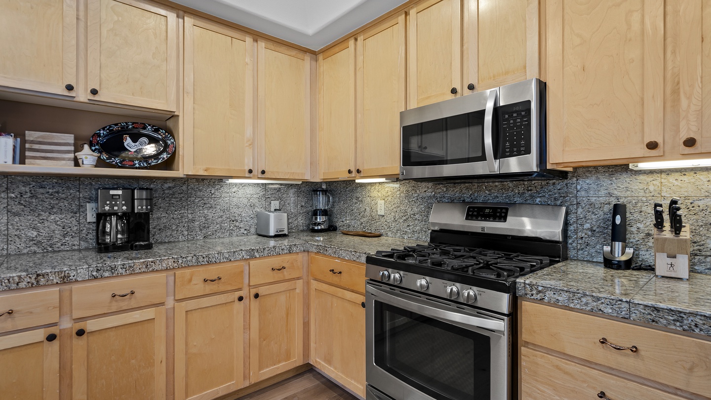 Your fully equipped kitchen features granite countertops, stainless steel appliances, and ample cabinet space—everything you need to prepare delicious home-cooked meals during your stay.