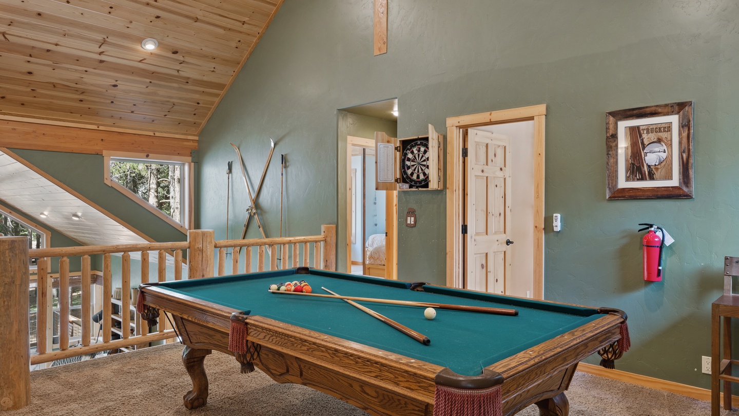 Challenge your friends to a friendly game on your private billiard table, set beneath soaring vaulted ceilings with warm wood beams and mountain-inspired décor that invites you to unwind and play.
