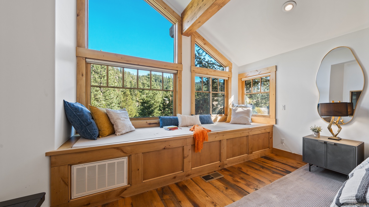 Curl up in your sunlit window nook with a good book and watch the pines sway just outside—your perfect retreat within a retreat.
