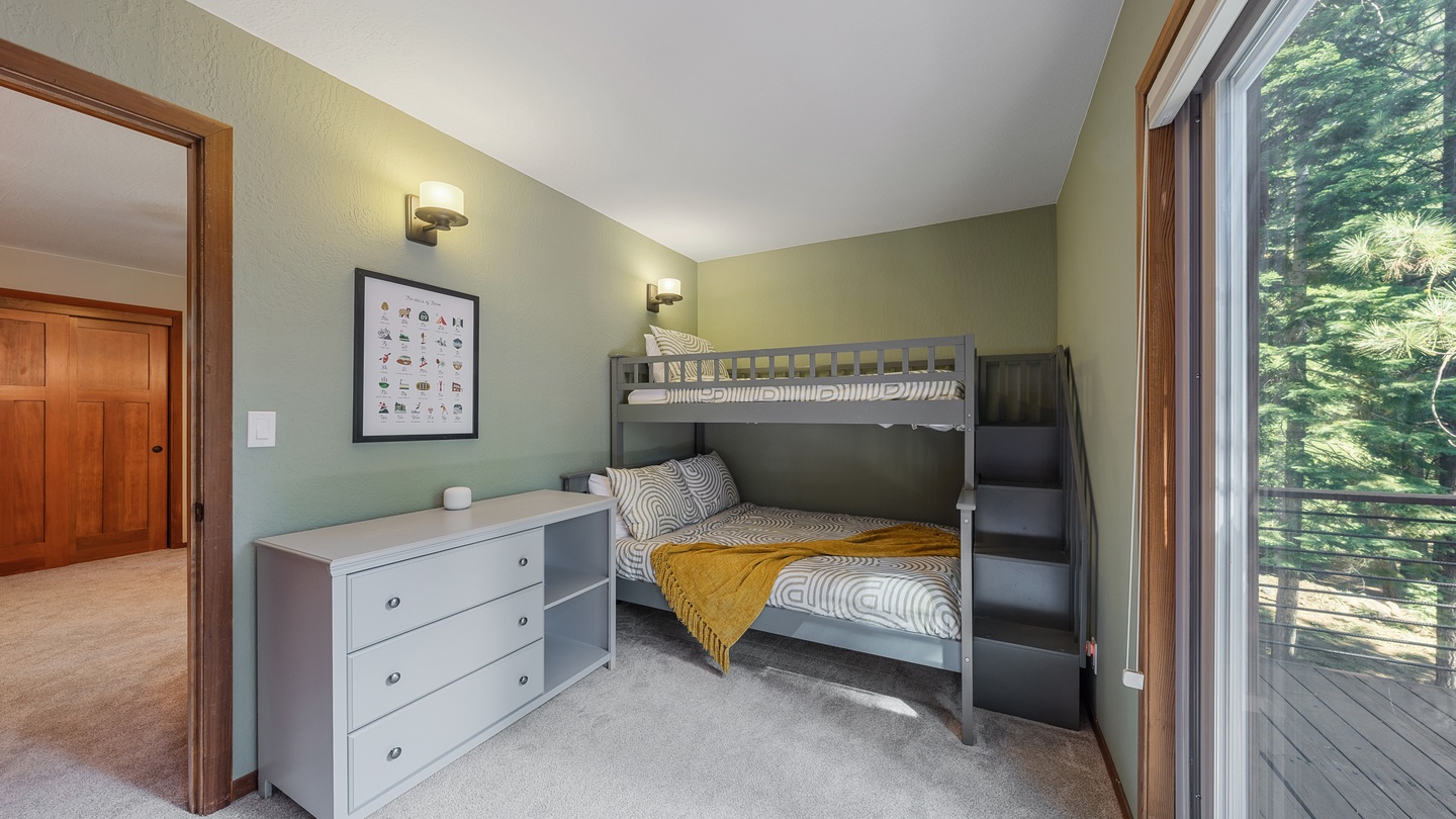 Your kids will love the bunk beds and private balcony in this cozy, nature-surrounded bedroom—perfect for bedtime stories or morning mountain views.