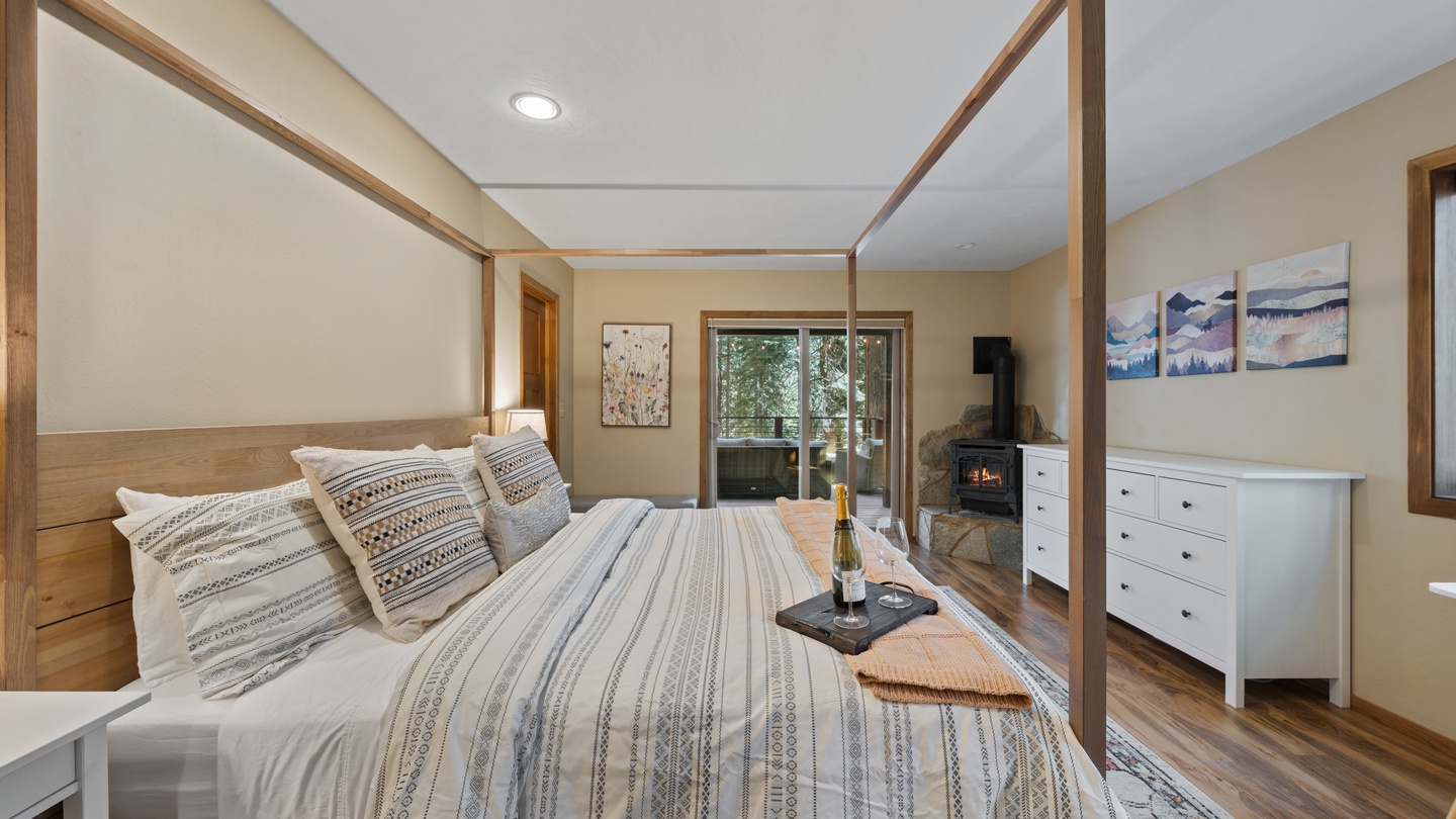 Unwind in your serene bedroom featuring a handsome four-poster bed and cozy fireplace. Step out to your private balcony and breathe in the fresh mountain air.