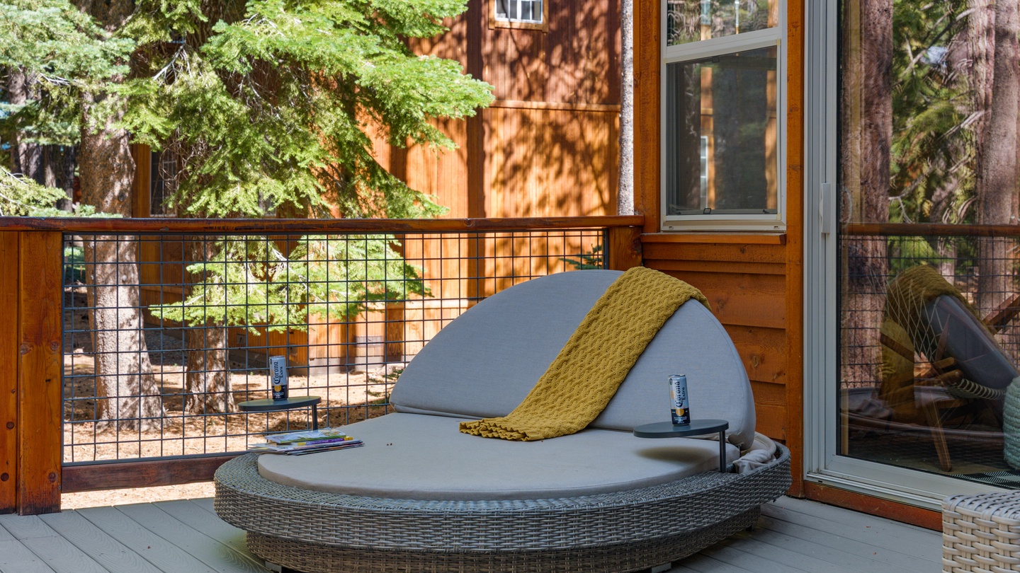 Step onto your private deck and unwind on a luxurious daybed surrounded by towering pines. Let the forest breeze and dappled sunlight melt your stress away.