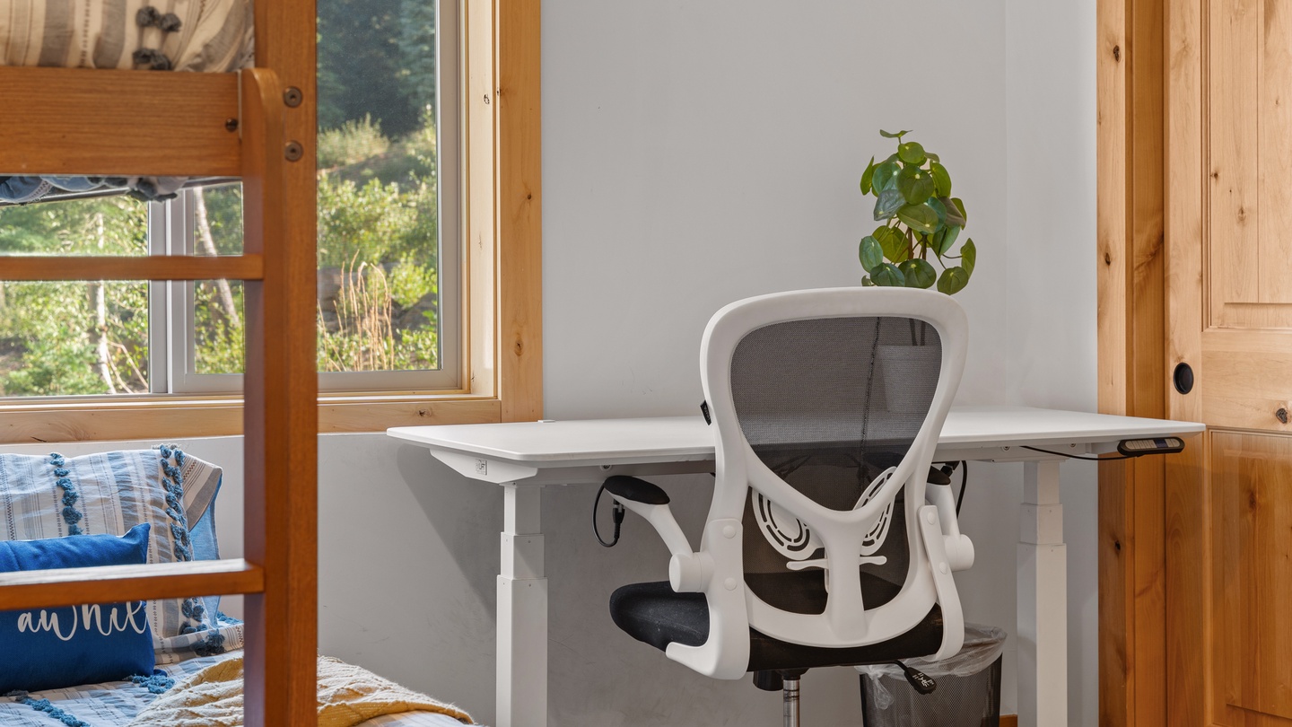 Your personal workspace awaits with a peaceful garden view, where natural light pours through the windows as you settle in to work or plan your next adventure.