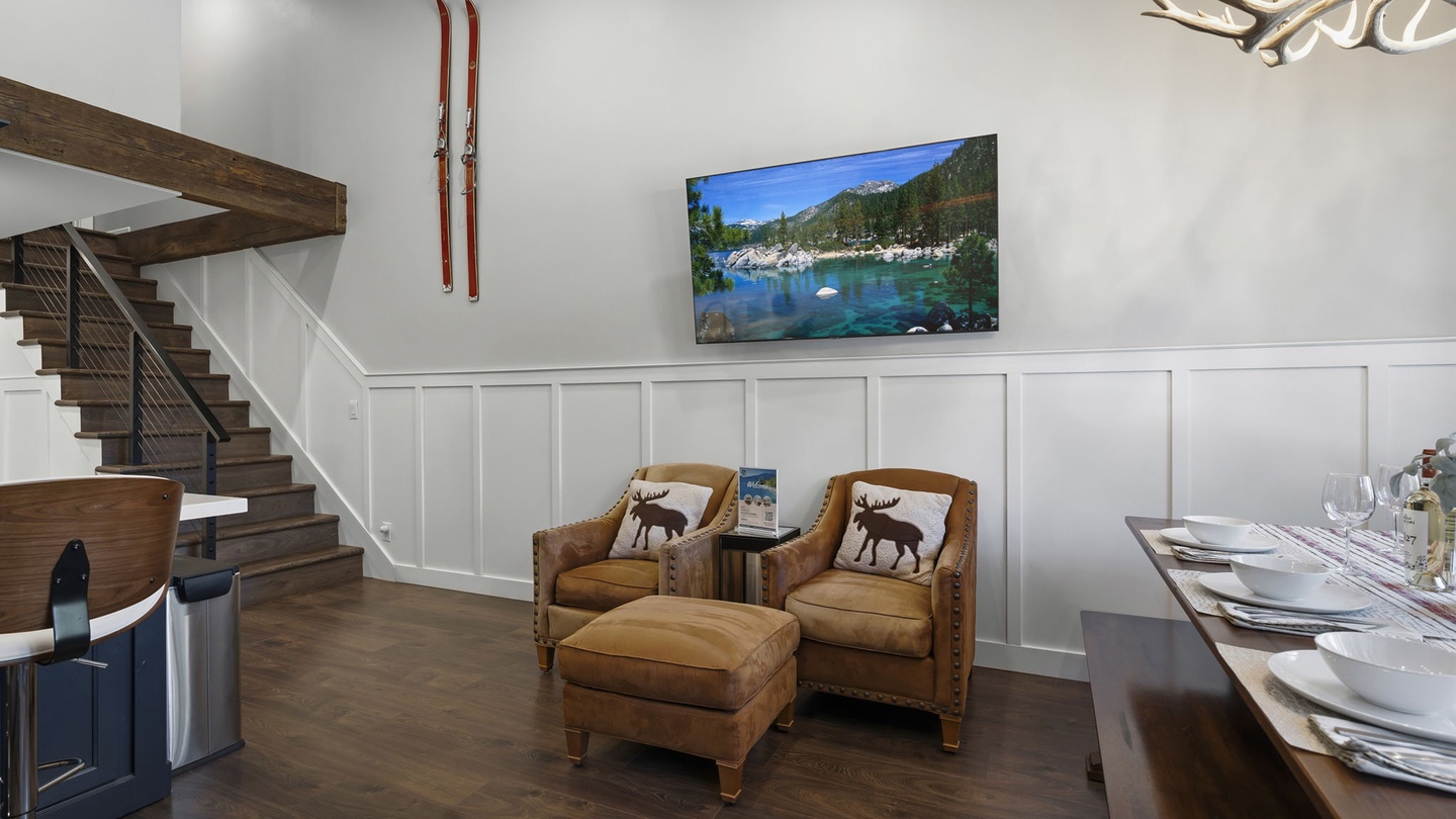 Sink into leather armchairs while mountain views play on the large TV in this elegant living space.