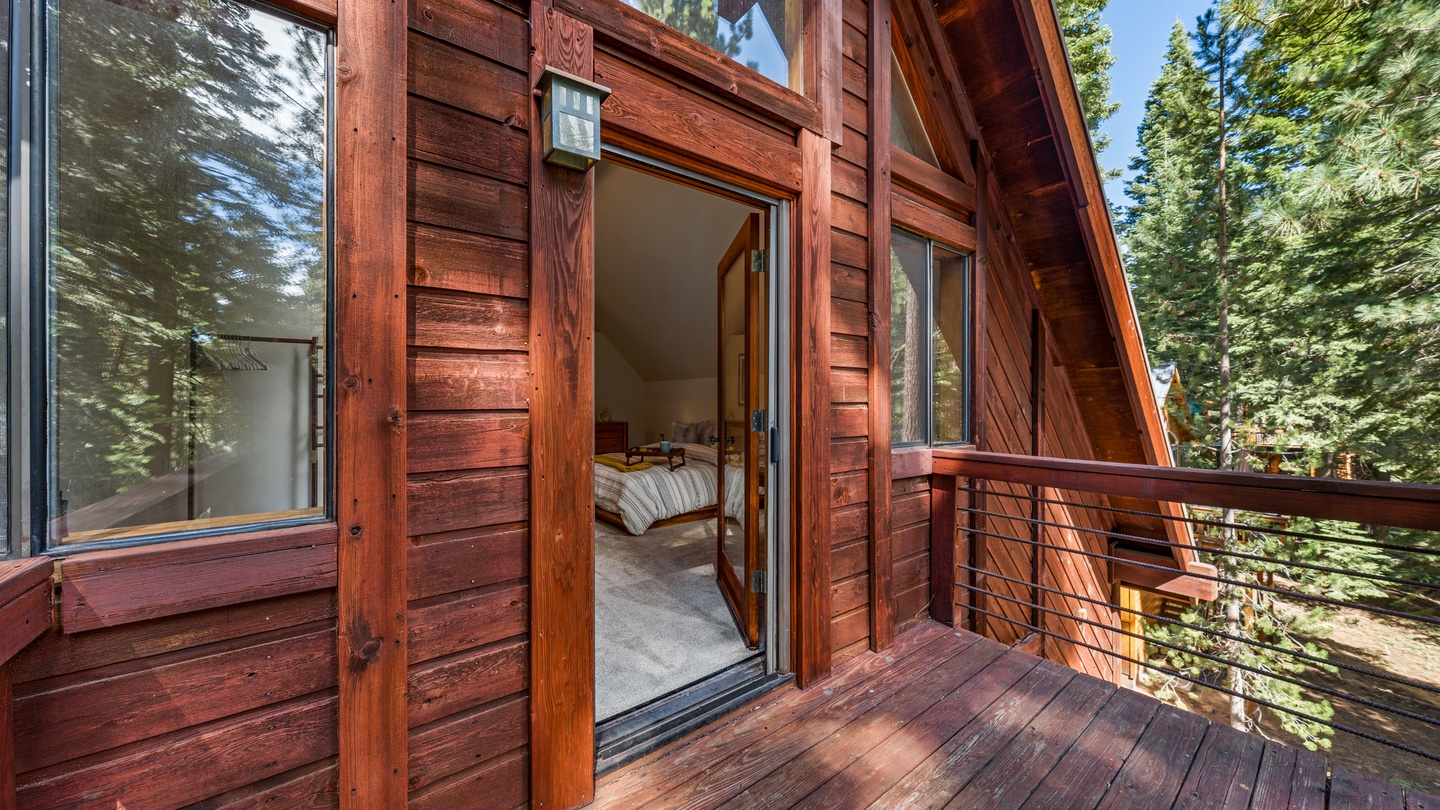 Step out onto your private balcony to breathe in the crisp mountain air and take in the towering pines surrounding your cozy cabin retreat.