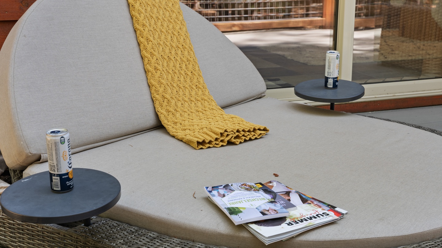 Settle into your private outdoor lounge with a cool drink and a good magazine. The cozy throw and plush cushions invite you to relax and unwind in the fresh air.