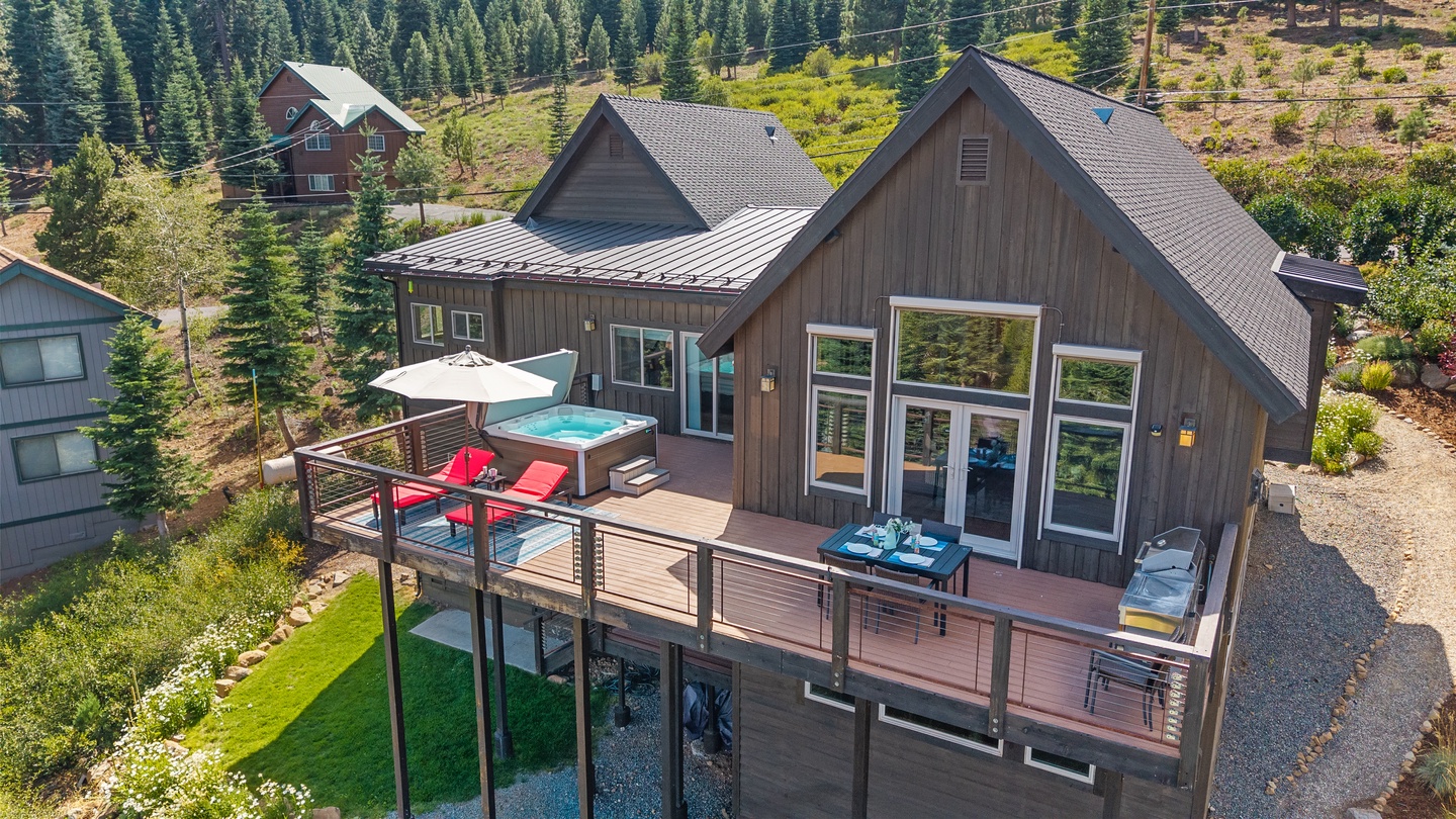A charming mountain property nestled among evergreens, offering serene forest surroundings and easy access to neighboring vacation homes within this quiet retreat area.