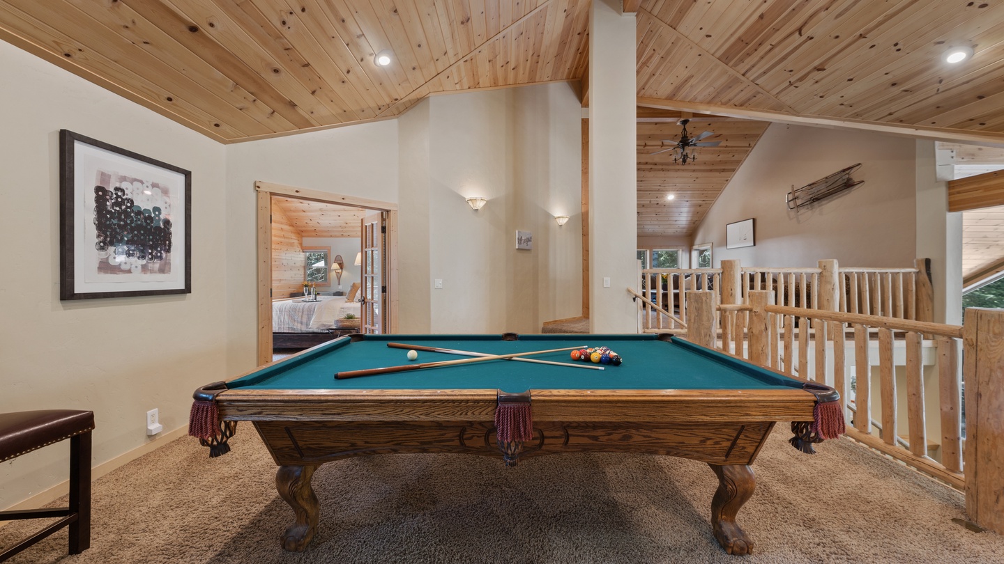 Challenge your friends to a friendly game in your own private billiards loft. The warm wood ceiling and open layout create a welcoming retreat for play and relaxation.