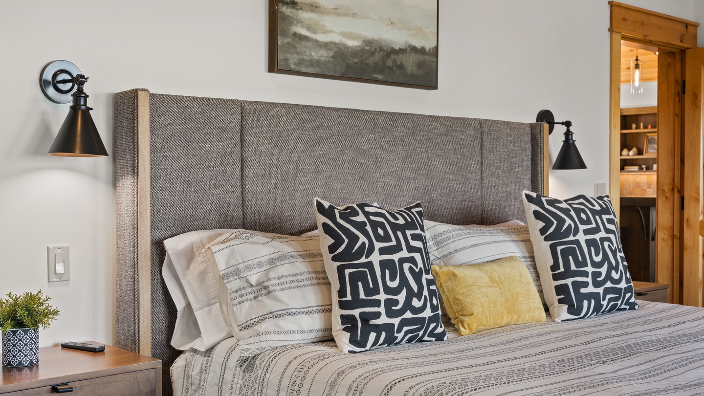 Sink into the plush upholstered headboard and crisp linens after a day of adventure. Warm bedside lighting and thoughtful decor create your perfect retreat.