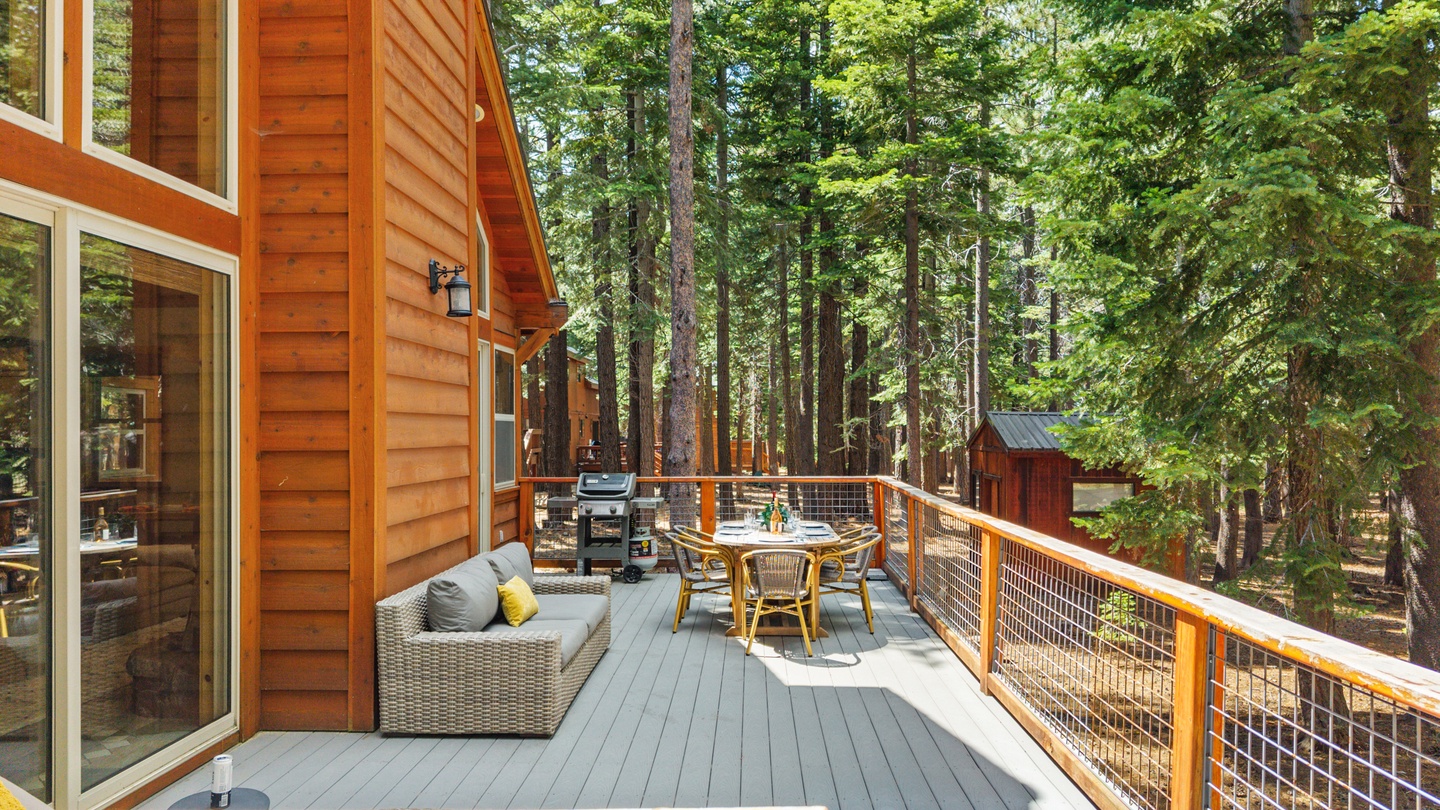 Step outside to your private deck, where towering pines surround you and fresh forest air invites relaxed evenings with a grill, cozy seating, and woodland views.