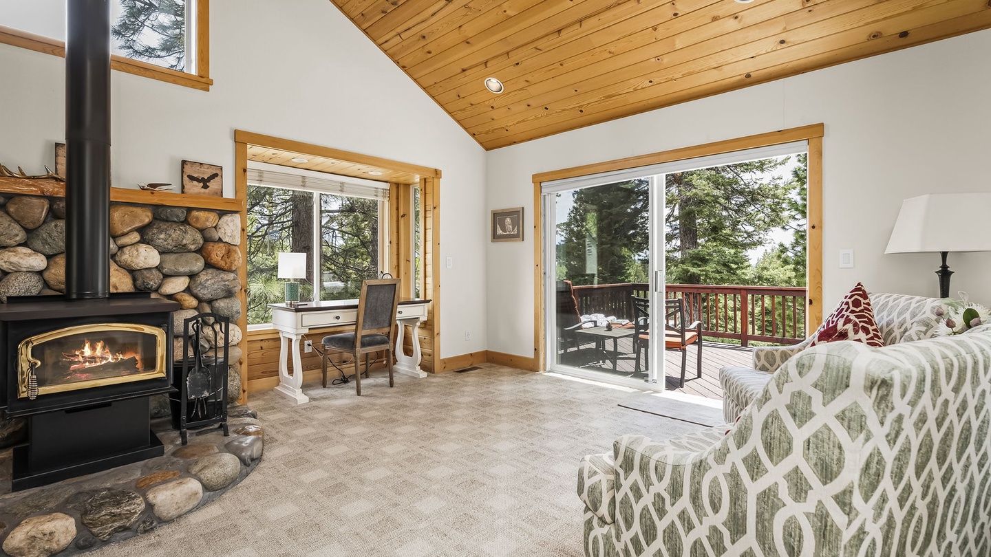 Living Room with wood-burning fireplace, and rustic river-rock hearth