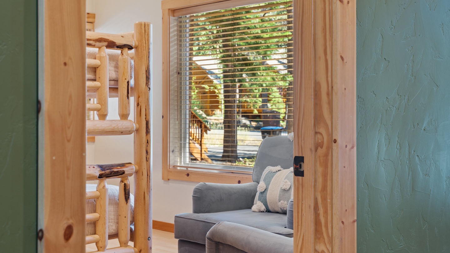 Step into your cozy retreat where rustic charm meets modern comfort. Natural wood accents and a plush seating area create the perfect spot for your morning coffee, while views of the surrounding greenery invite the outdoors in.