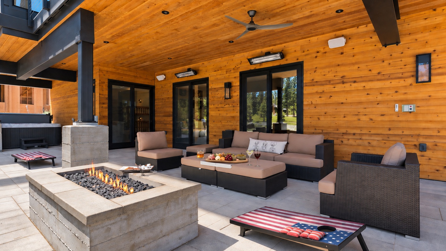 Alpine Greenside Estate back porch, firepit, games, hot tub, fan and heaters.