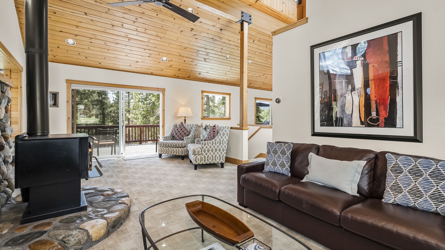 Living Room with wood-burning fireplace, and rustic river-rock hearth