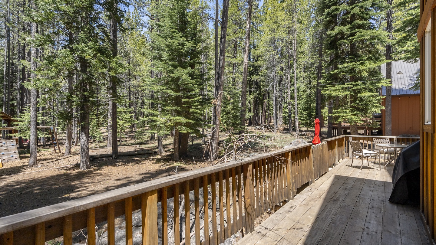 Nestled in a peaceful forest setting, this property offers a serene escape with nature as your backdrop. Tall pines surround the area, creating a secluded retreat.