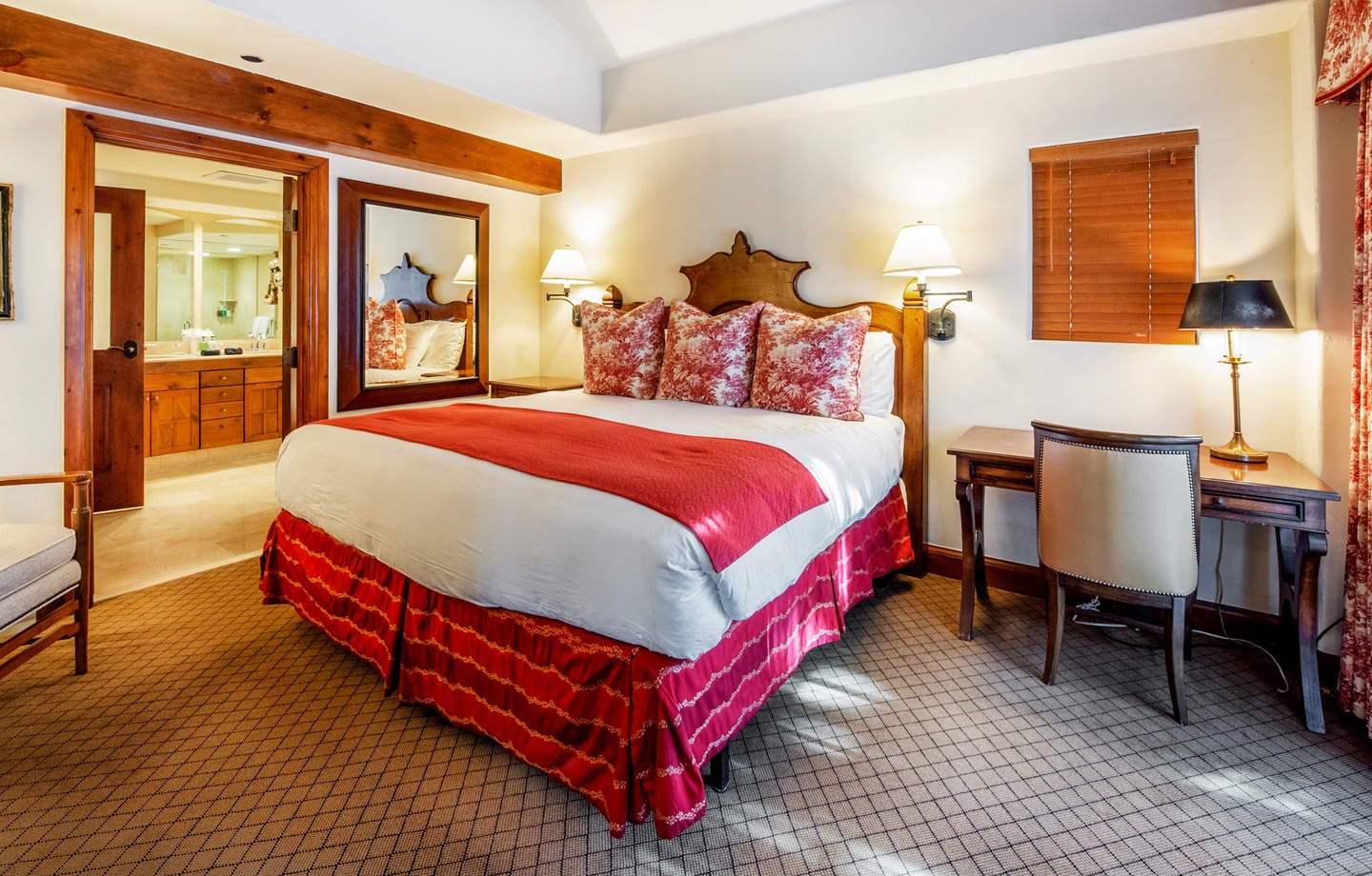 Sink into plush comfort in your inviting bedroom, where warm wood accents and elegant touches create a restful retreat after your mountain adventures.