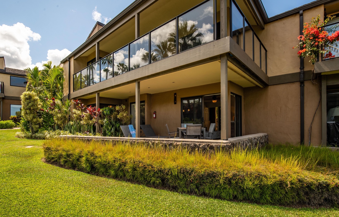 Two large swimming pools, a shared hot tub, paddle tennis, and a poolside fitness center — all within 24 acres of tropical grounds.