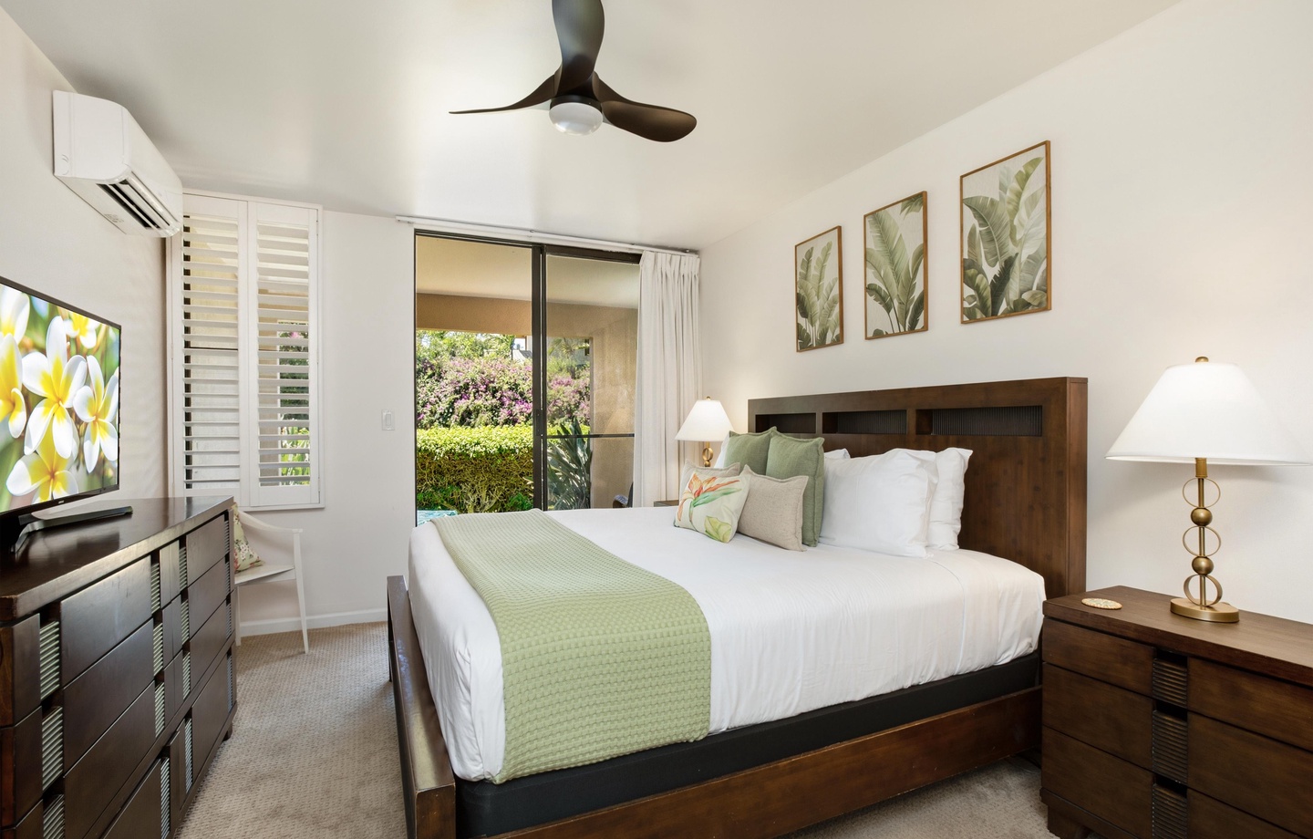 Sink into crisp linens and let the tropical breeze from your garden patio lull you into pure relaxation. Your peaceful retreat awaits.