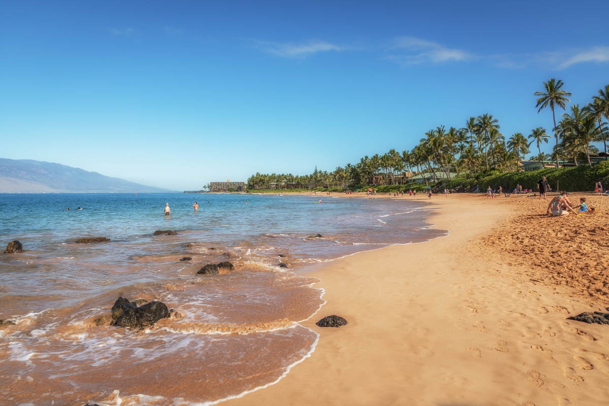 Keawakapu Beach is a short walk through the tropical gardens, where sea turtles glide offshore year-round.