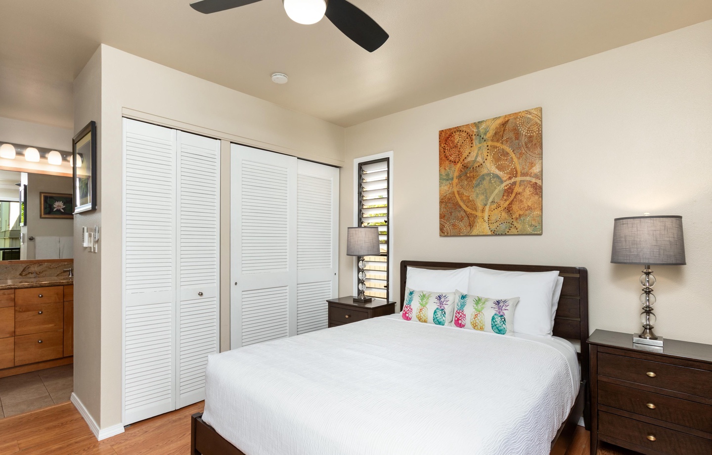 Sink into crisp linens and let the gentle whir of the ceiling fan lull you to sleep. Your peaceful retreat features ample closet space and playful tropical touches to brighten your mornings.