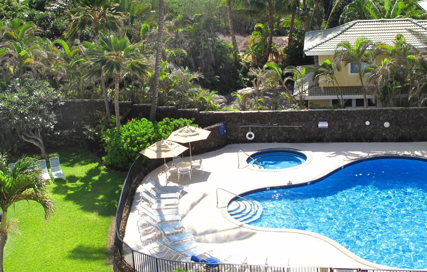 The inviting pool deck has recliners in both the sun and shade. Or choose to sunbathe on the oceanfront manicured lawn.