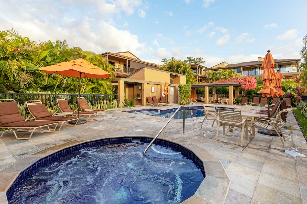 Soothe your muscles in the shared hot tub located at the upper pool.