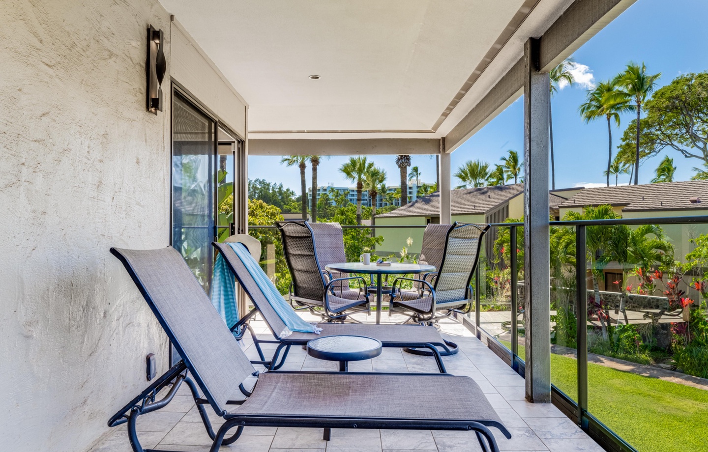 This remodeled 1025 sq.ft. 2nd-floor condo has vaulted ceilings and an elevated outlook over the tropical grounds, with a spacious lanai and some partial ocean views