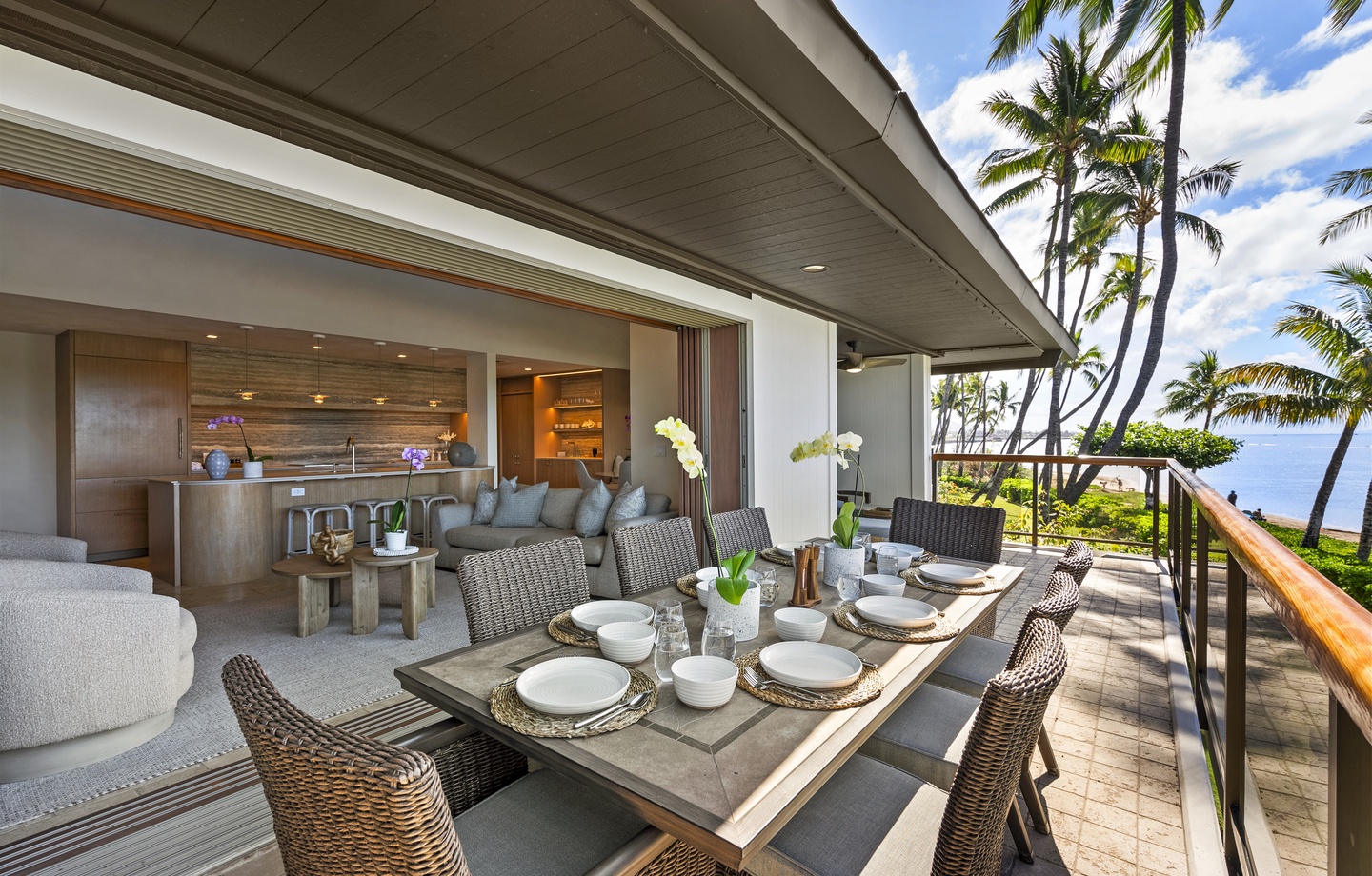 Dine al fresco on your private covered lanai, where tropical breezes meet elegant comfort and ocean views stretch beyond swaying palms.