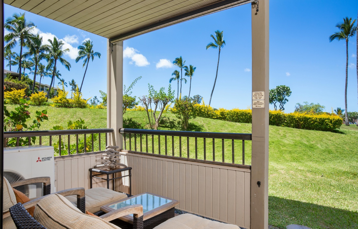 Step onto your private lanai and soak in the tropical paradise—swaying palms, lush greenery, and endless blue skies framing your peaceful retreat.