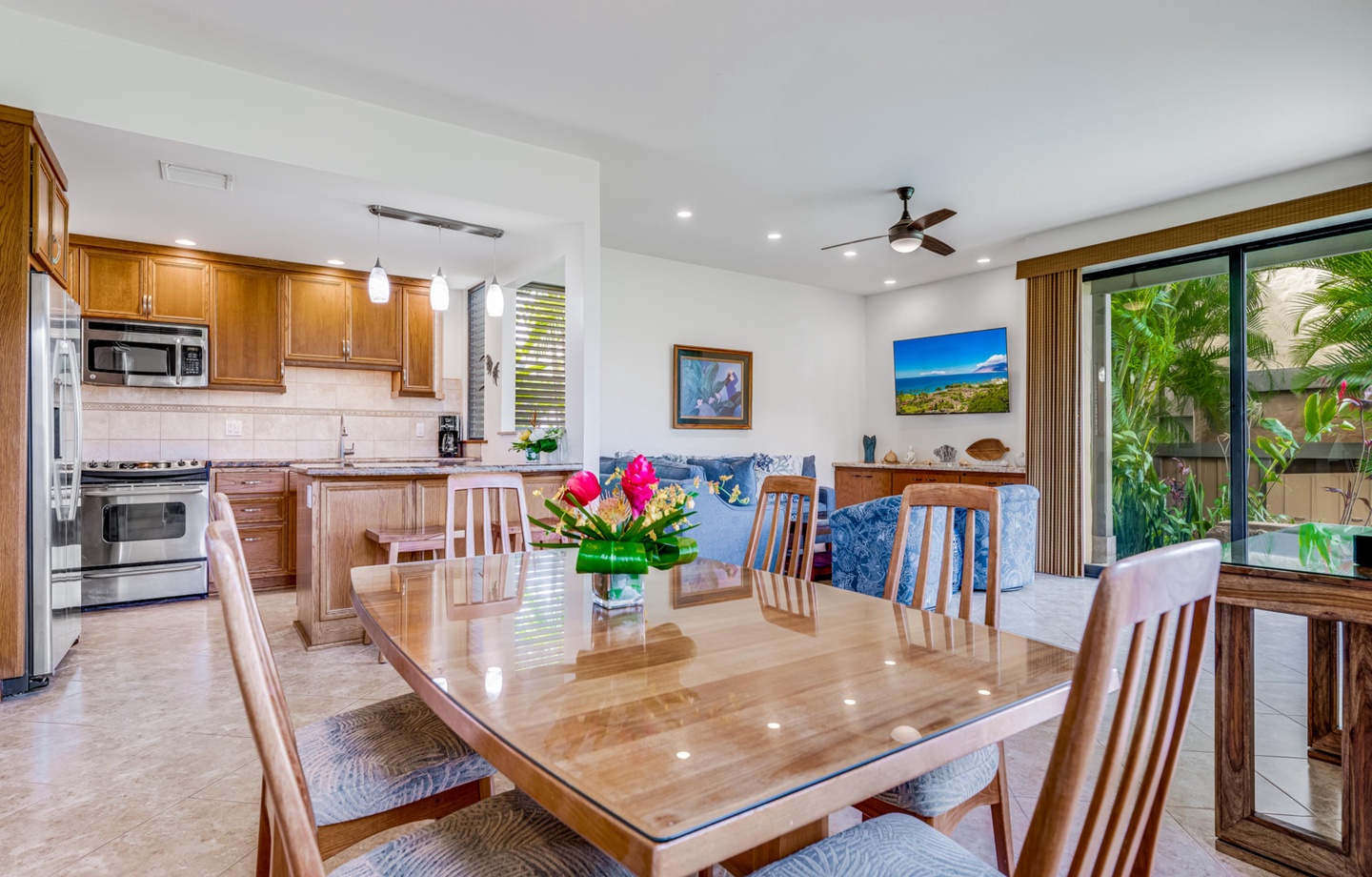 pread out across a meticulously kept layout that seamlessly connects the kitchen, dining, and living spaces to the outdoor patio.