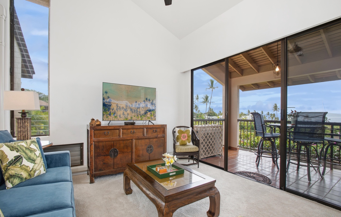Step into your island retreat where tropical breezes and ocean views greet you. Relax in this bright, open living space that flows seamlessly onto your private lanai—perfect for morning coffee or evening cocktails.
