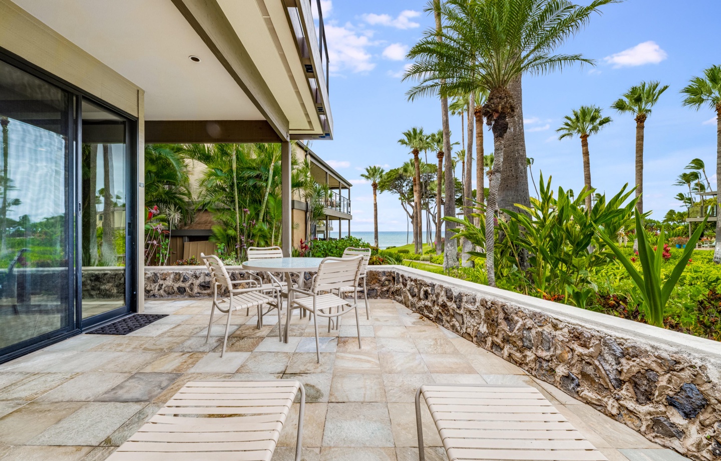 This ground floor 1,336 sq.ft., 2-bedroom condo features a extra large patio with ocean views, 2 resort pools, a shared hot tub, and 24 acres of tropical grounds.