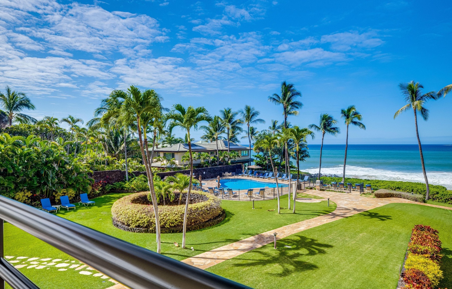 Features wrap-around ocean views from 2 private lanais, high-end kitchen with wine and beverage refrigerators, and direct beach access.