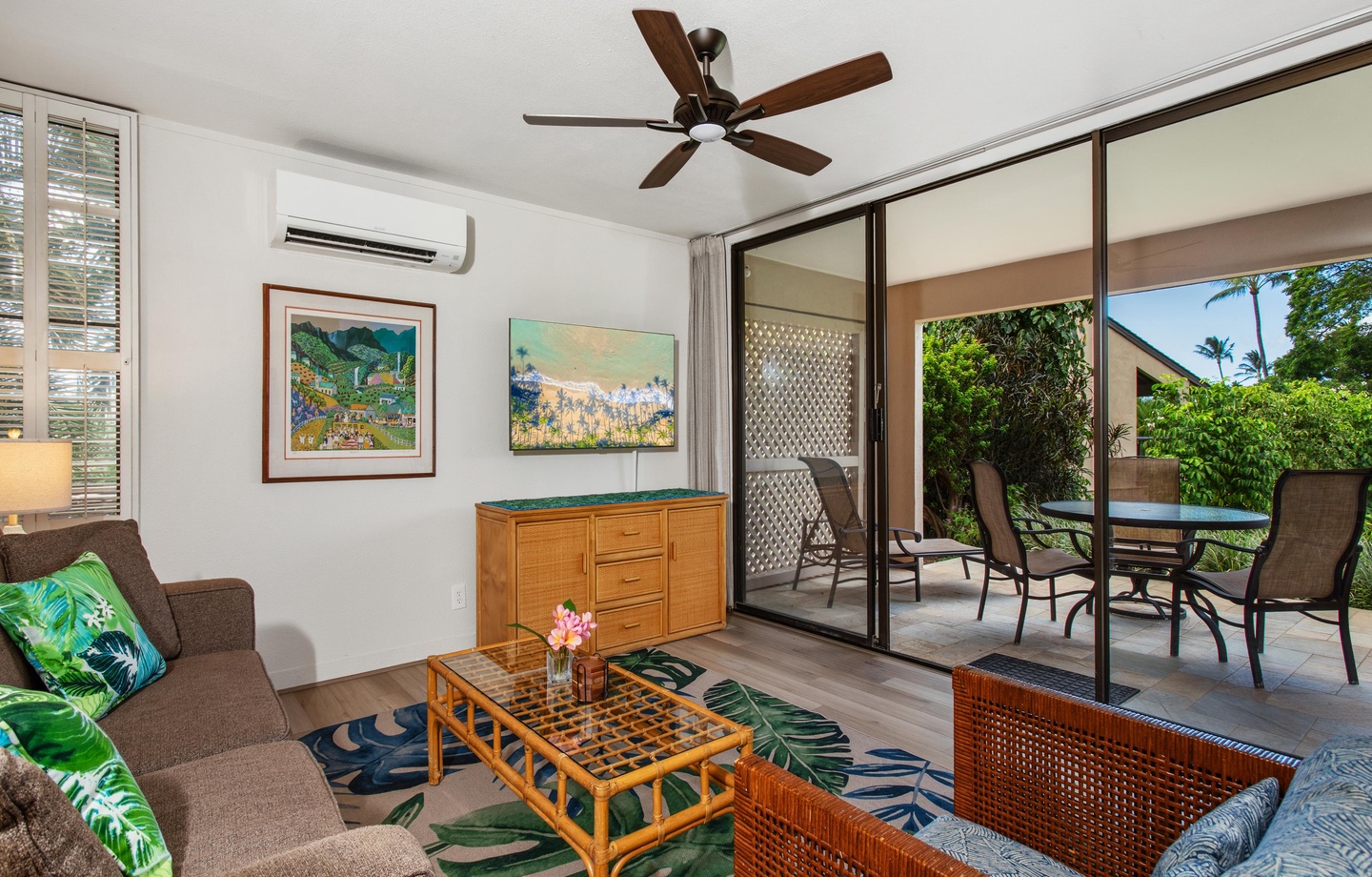 Your bright, breezy living space opens seamlessly to your private covered patio—perfect for morning coffee or evening conversations surrounded by lush tropical gardens.