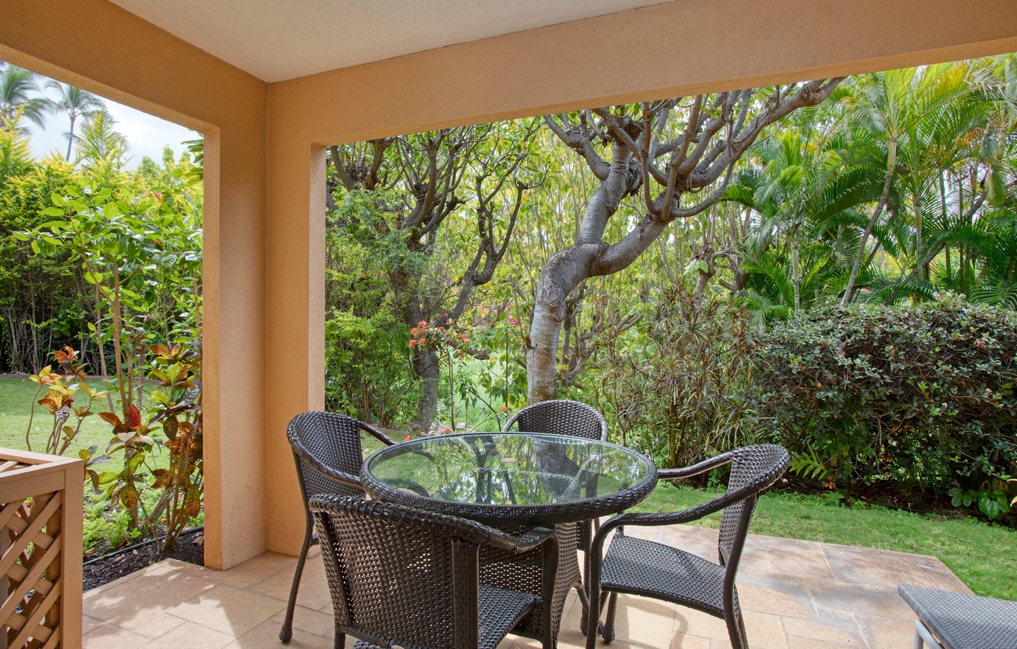 Large Covered Lanai: Relax on your private outdoor covered porch surrounded by peaceful garden foliage.