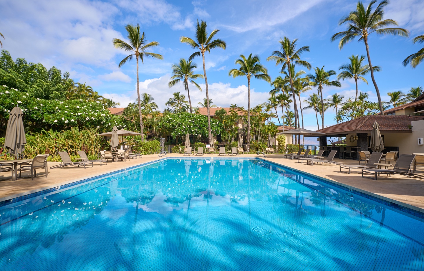 On-site, enjoy 2 heated pools, shared hot tubs, and tennis courts nestled along 10 acres of beautifully maintained tropical gardens.