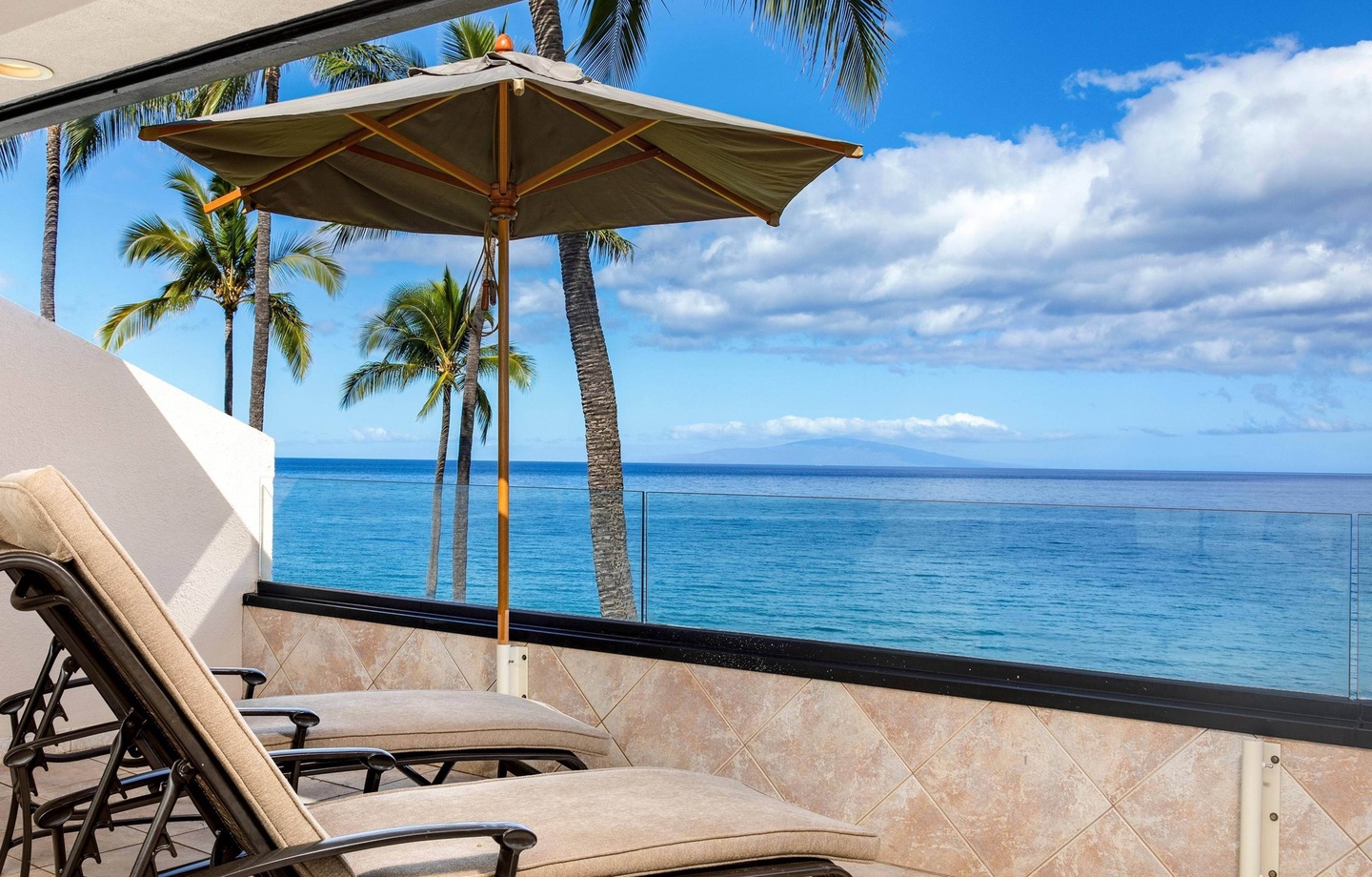 Elevated 3rd-floor position provides sweeping, unobstructed Pacific views overlooking Poʻolenalena and Chang's beaches.