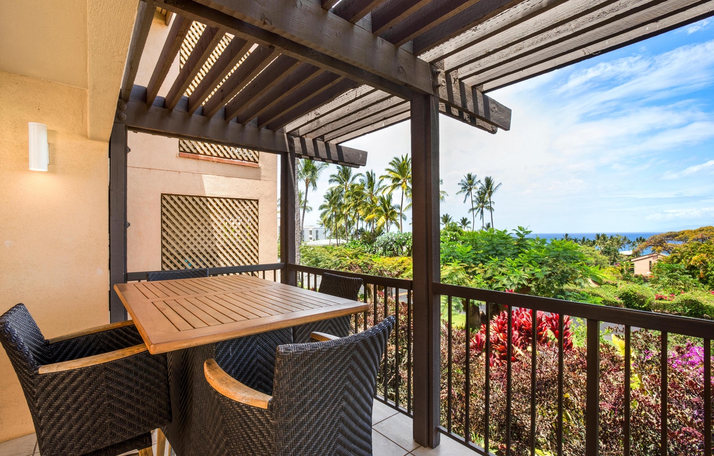 Lanai: A relaxing 2nd-floor outdoor space off the living area featuring comfortable furniture and garden views.