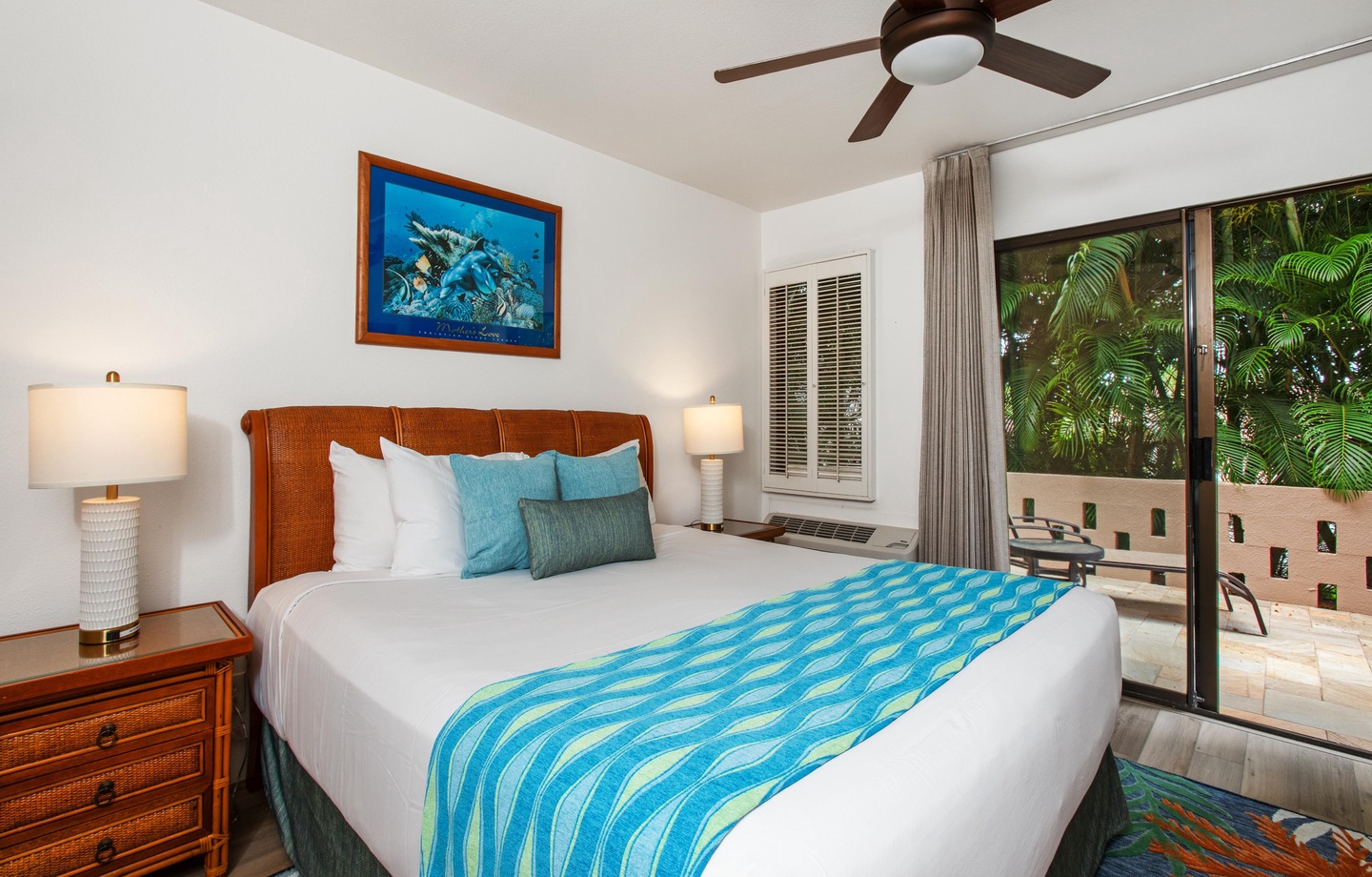 Your tropical retreat awaits with crisp linens, soothing ocean-inspired tones, and a private patio surrounded by lush greenery—perfect for your island escape.