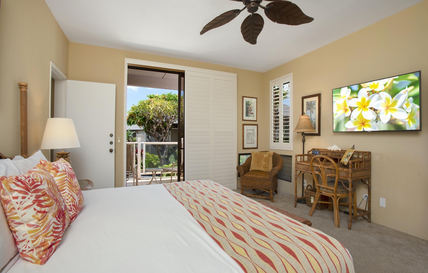 Your tropical retreat features a cozy bedroom with garden views and a comfortable work desk, perfect for balancing relaxation and productivity during your stay.