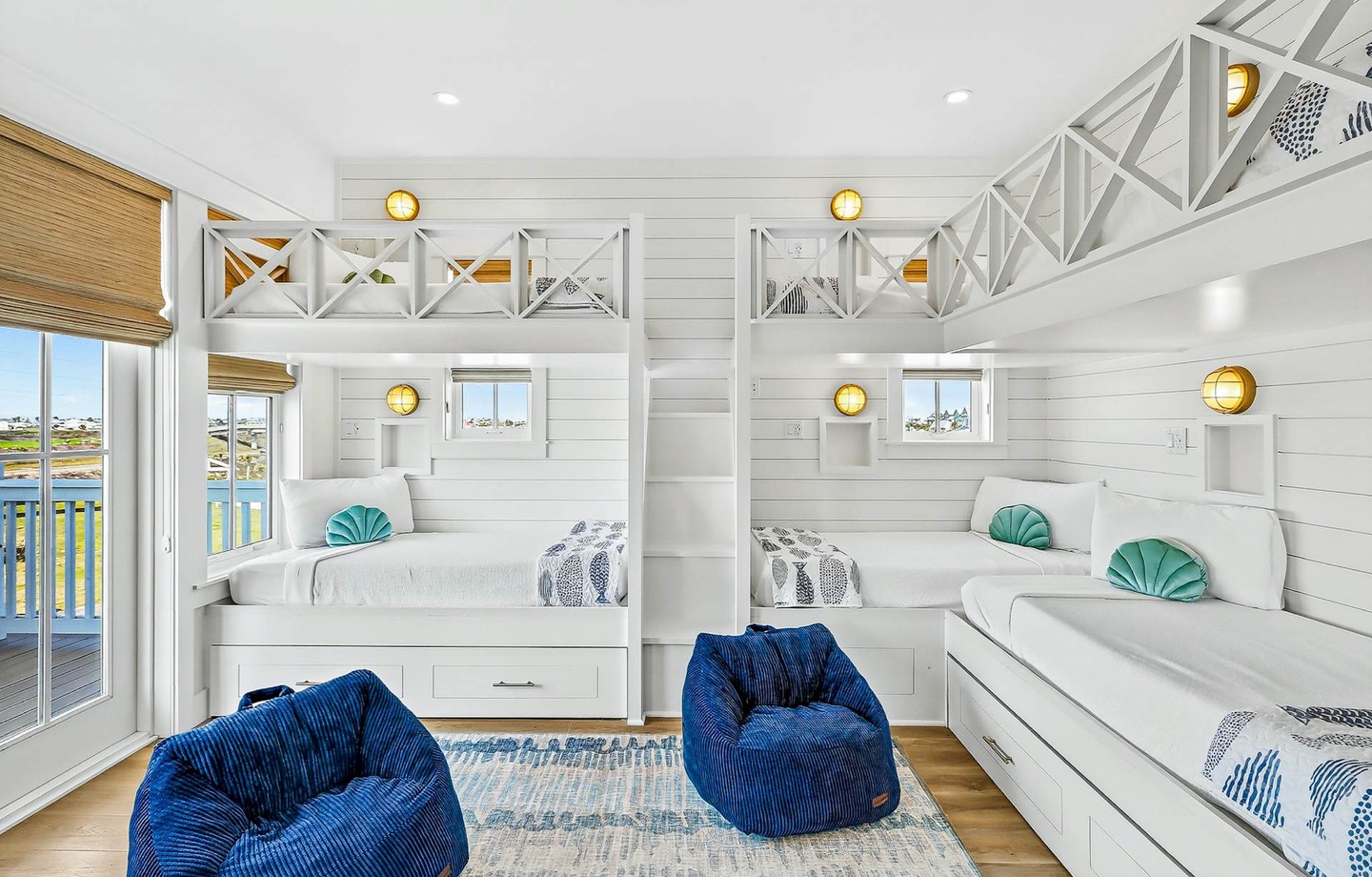 Kids will love this bright bunk room with custom nautical-style built-ins and serene views of the water through your windows—perfect for their own seaside adventure.