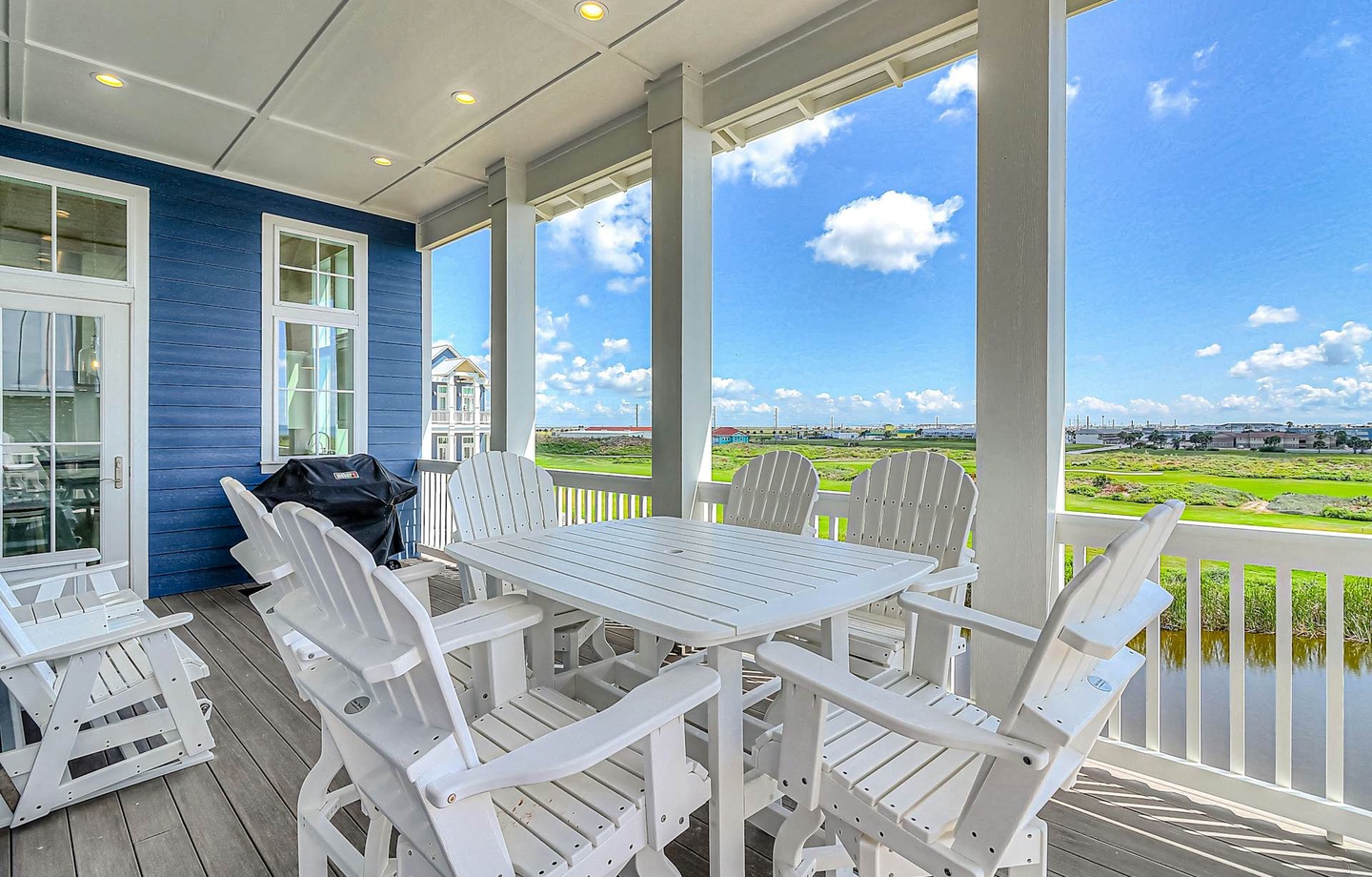 Gather for meals or morning coffee on your private covered porch, where panoramic marsh and waterfront views stretch out before you—a tranquil escape that's yours to enjoy.