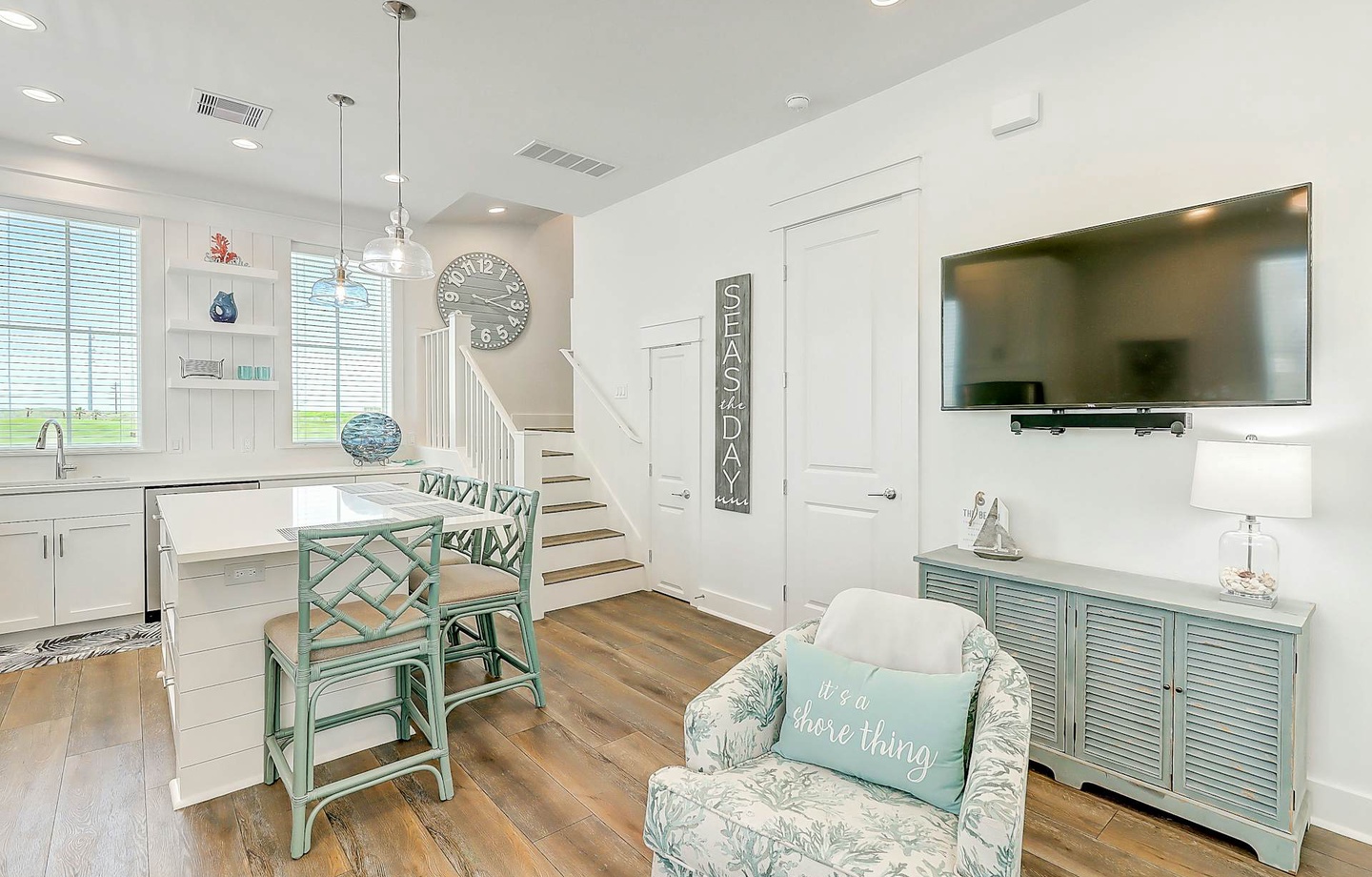 Step into this bright, coastal-inspired living space where charm meets comfort. Soft blues and whites create a breezy, beach-house feel, inviting you to relax and unwind after your day by the shore.