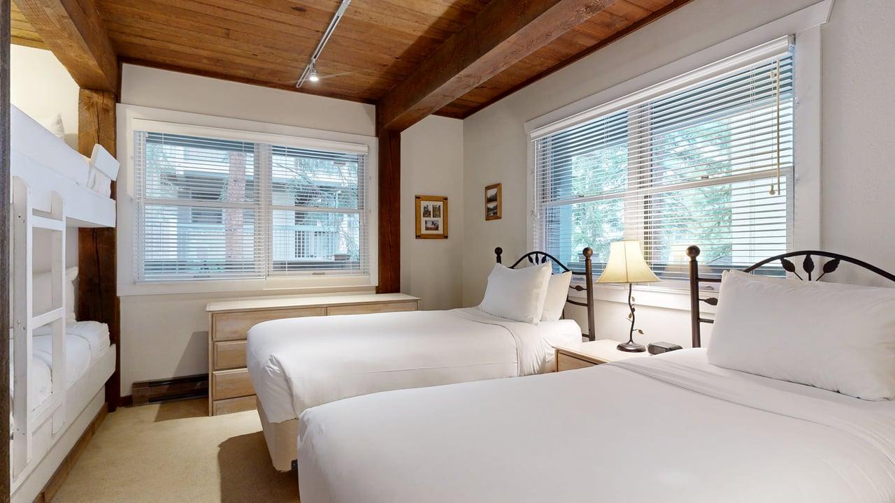 Bedroom with Two Twin Beds and a Bunk Bed