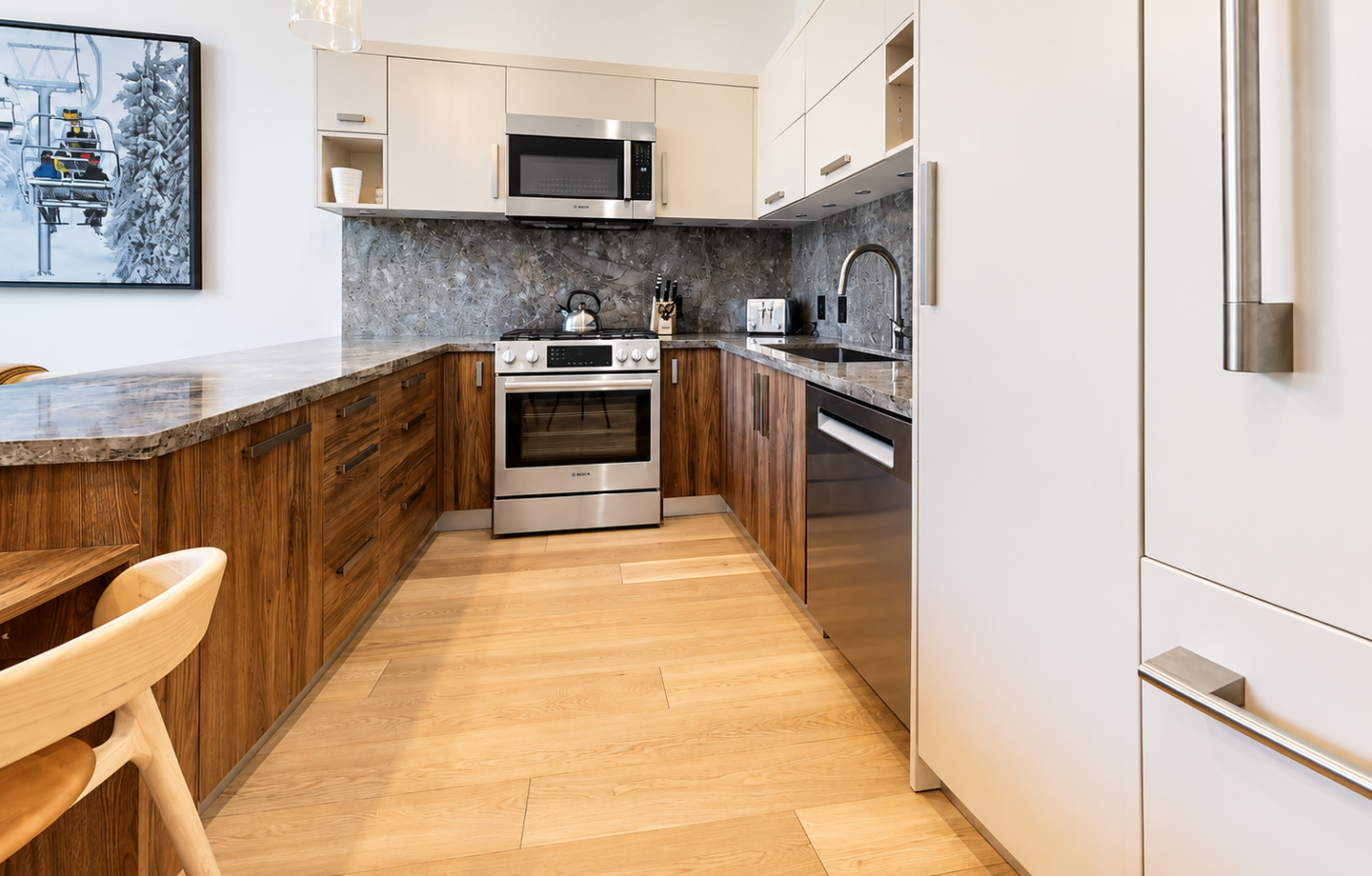Your fully equipped kitchen blends modern style with mountain warmth—rich wood cabinetry, sleek granite counters, and stainless steel appliances make preparing meals a pleasure during your stay.